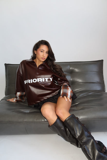 Priority faux leather statement sweater