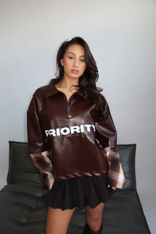 Priority faux leather statement sweater
